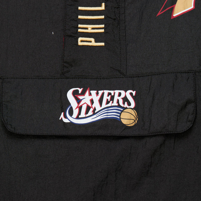 NBA TEAM OG 2.0 ANORAK WINDBREAKER VINTAGE LOGO 76ERS Black OJPO7093-P76YYPPPBLCK - Image 1 NBA TEAM OG 2.0 ANORAK WINDBREAKER VINTAGE LOGO 76ERS Black OJPO7093-P76YYPPPBLCK - Image 1